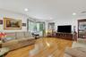 Living room with hardwood floors, recessed lighting, sunlight