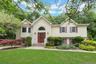 Front of home with landscaping, front lawn, end of a cul-de-sac