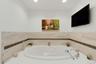 Ensuite with spa-like jacuzzi soaking tub