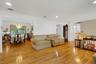 Living room open layout to dining room, hardwood floors, recessed lighting, sunlight