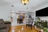 Family room with hardwood floors open layout to kitchen