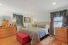 Primary bedroom with hardwood floors, recessed lighting, walk-in closet and luxury spa-like ensuite barthroom