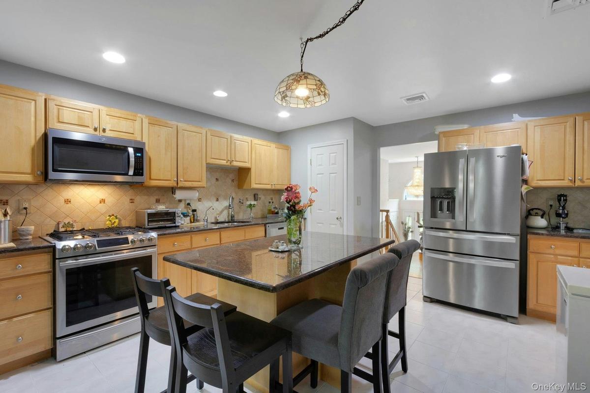 Kitchen with stainless appliances and center island