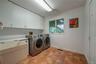 1st floor huge laundry room with plenty of storage & walk in closet