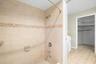 Primary bathroom and walk-in closet