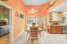 Ceramic tile throughout kitchen with pot shelves