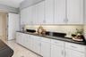 There is endless cabinet and counter space, pantry and a separate laundry room off of the kitchen
