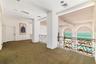 Primary Bedroom with ensuite and walk-in closets behind closed door, walk out terraces overlooking ocean. There is great wall space throughout the hom