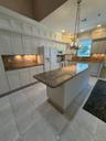 DYNOMITE kitchen, overly generous granite  countertops, center Island very large, w/seating at the end, pull out drawers