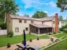 Expansive paver patio with a built-in fire pit