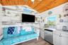 Cabana has kitchen, TV, and a futon