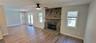 Family room by the kitchen with a wood burning fireplace for those cool winter nights!
