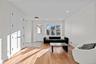 Living area featuring light wood-style flooring and recessed lighting