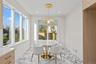 Dining area featuring light marble finish flooring, recessed lighting, and plenty of natural light