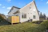 Back of house featuring a yard and a deck