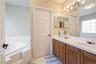 Sink and door to private toilet