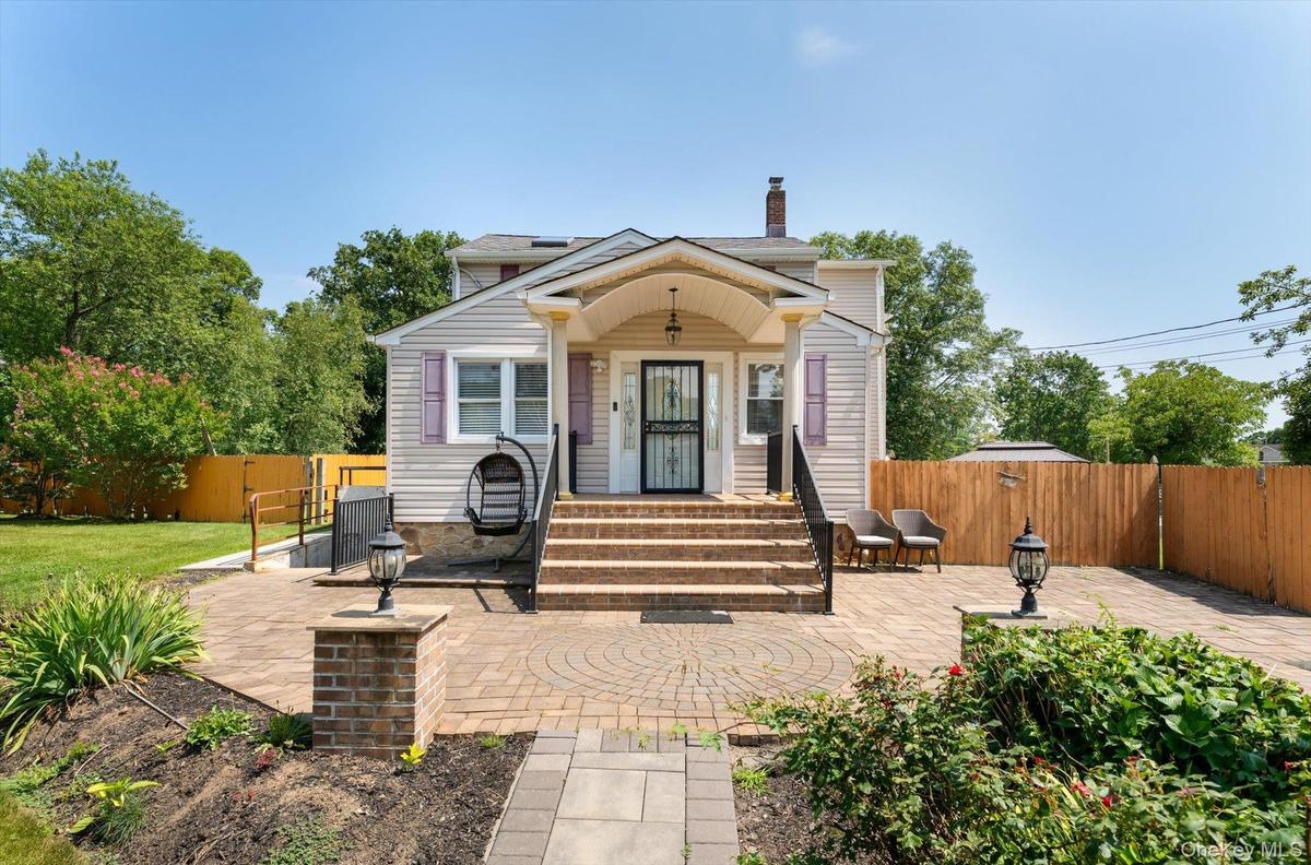 Beautiful pavers lead the way to this unique and versatile home!