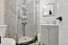 Bathroom with a stall shower and vanity