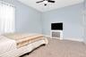 Bedroom featuring carpet and ceiling fan