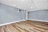 Finished basement with recessed lighting and wood finished floors