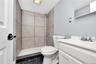 Bathroom featuring vanity and a tile shower