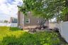Back of property with a fenced backyard, a patio, and stairway