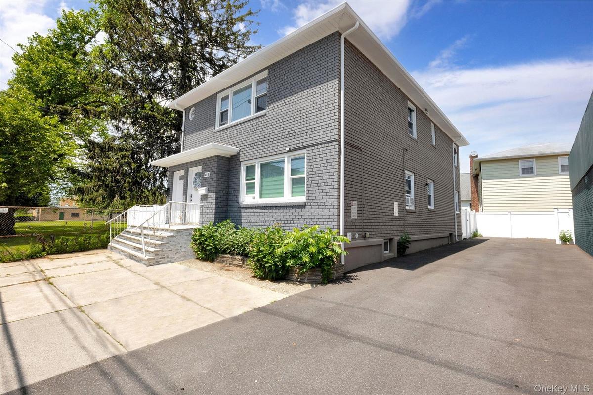 View of front of house with brick siding