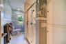 Luxury bath with fully tiled standup shower.
