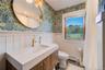 A second newly decorated bath with a tub-shower.