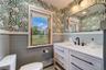 One of two custom decorated full baths!