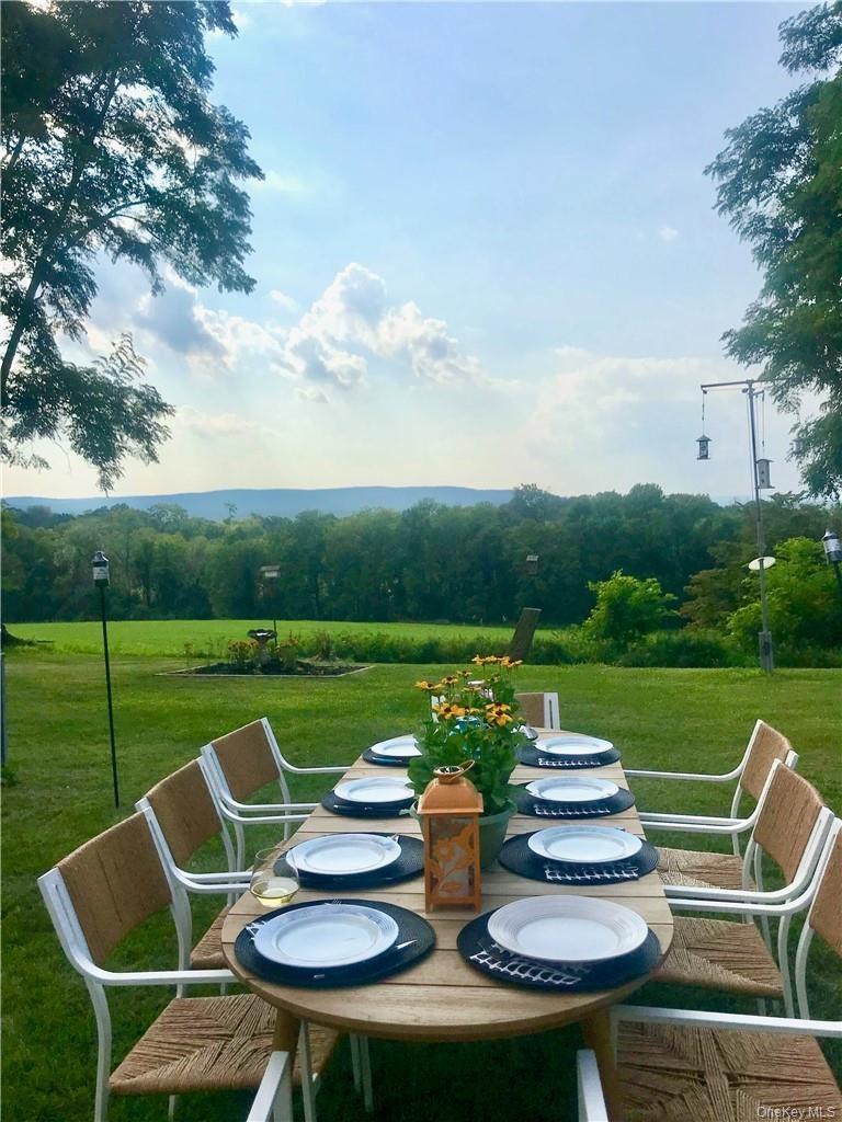 Dine al-fresco in your yard and soak in the incredible views... plenty of room for up to two horses or several mid-size farm animals!