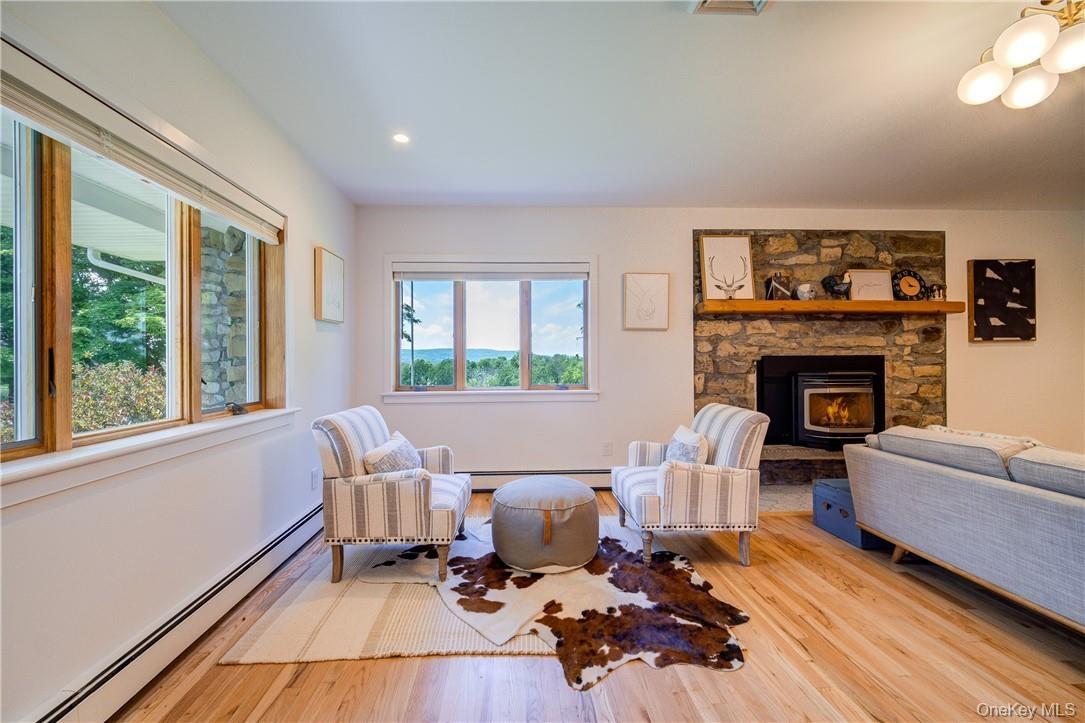 Enter in from the porch to this inviting living room with pellet stove insert for chilly nights!