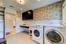 High end washer dryer set in this spacious mud room.