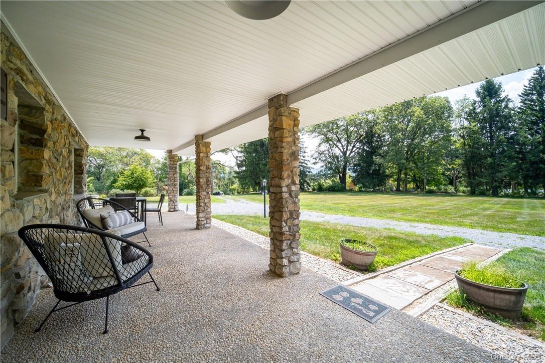 Oversized covered-front porch offers plenty of space for relaxing!