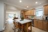 Kitchen with New Appliances.  Open to the Family Room/Dining Area. Virtually Staged