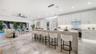 Open-concept kitchen with pool views.