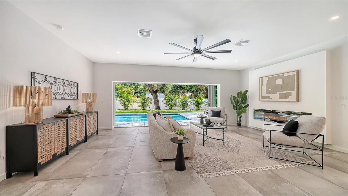 Open living area with pool views.