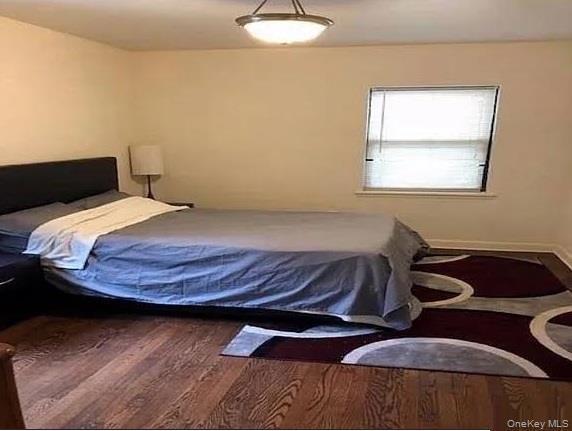 Bedroom with wood finished floors