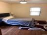 Bedroom with wood finished floors