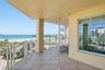 Covered waterfront balcony ideal for relaxing and there is enough room for a dining al fresco experience!