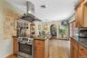 island with electric range with exhaust hood.
