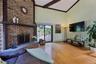 Walk out to wrap around deck through the two slighting doors on both side off the fireplace