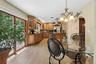 Eat-in kitchen with glass slighting door to off kitchen balcony.