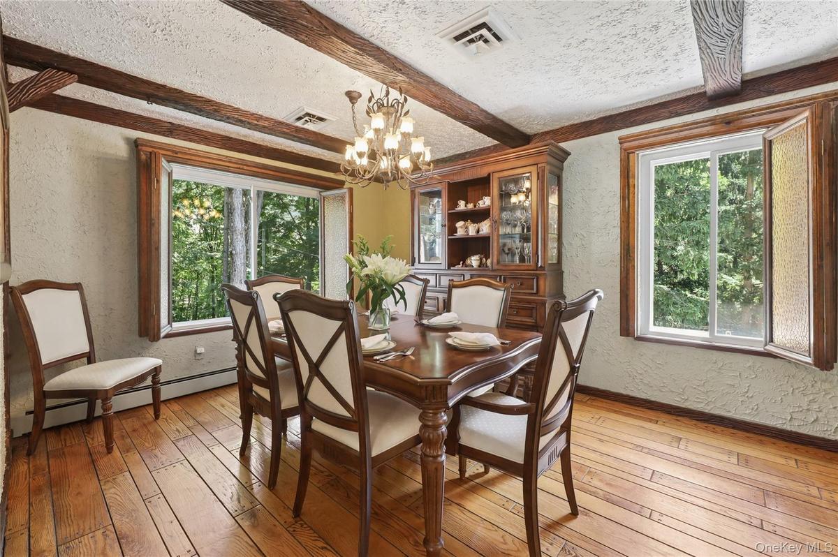 2 large windows with beautiful stained-glass shades, beamed ceiling.