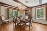 2 large windows with beautiful stained-glass shades, beamed ceiling.