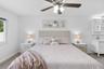 Escape to the spacious primary suite, complete with a beautifully updated en-suite bathroom featuring dual vanities, a stylish walk-in shower, and ele