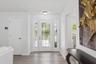 A welcoming foyer greets you upon entry, setting the tone for the warm and inviting living spaces beyond.