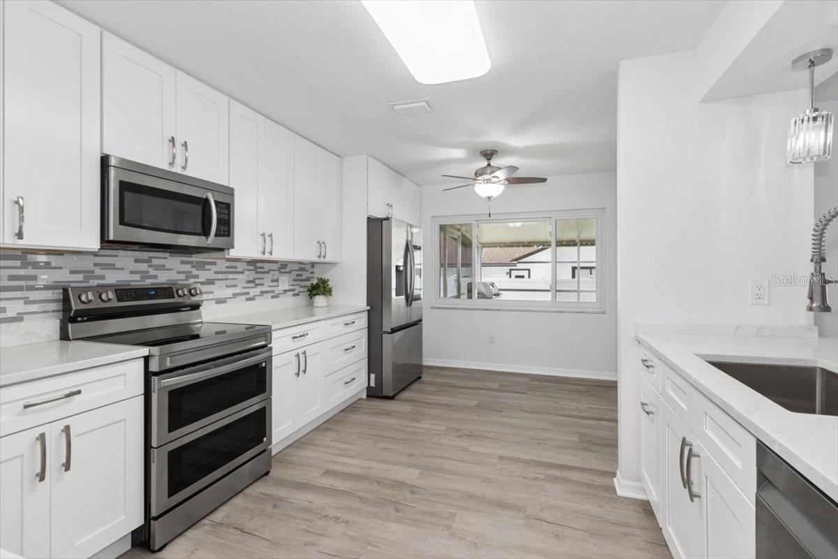 Designed with today's lifestyle in mind, the fully remodeled kitchen features modern finishes, ample storage, and an inviting space for gathering with