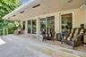 Breakfast nook, kitchen doors leading leading out to pool and backyard area
