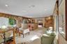 Open living room and dining area. Family, dining, breakfast nook toward the back right of the photo.